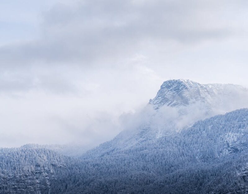 Mountain Landscapes - Serene winter view of a misty, snow-covered moun #35039349